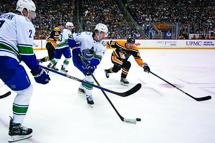 Penguins hold on in wild affair